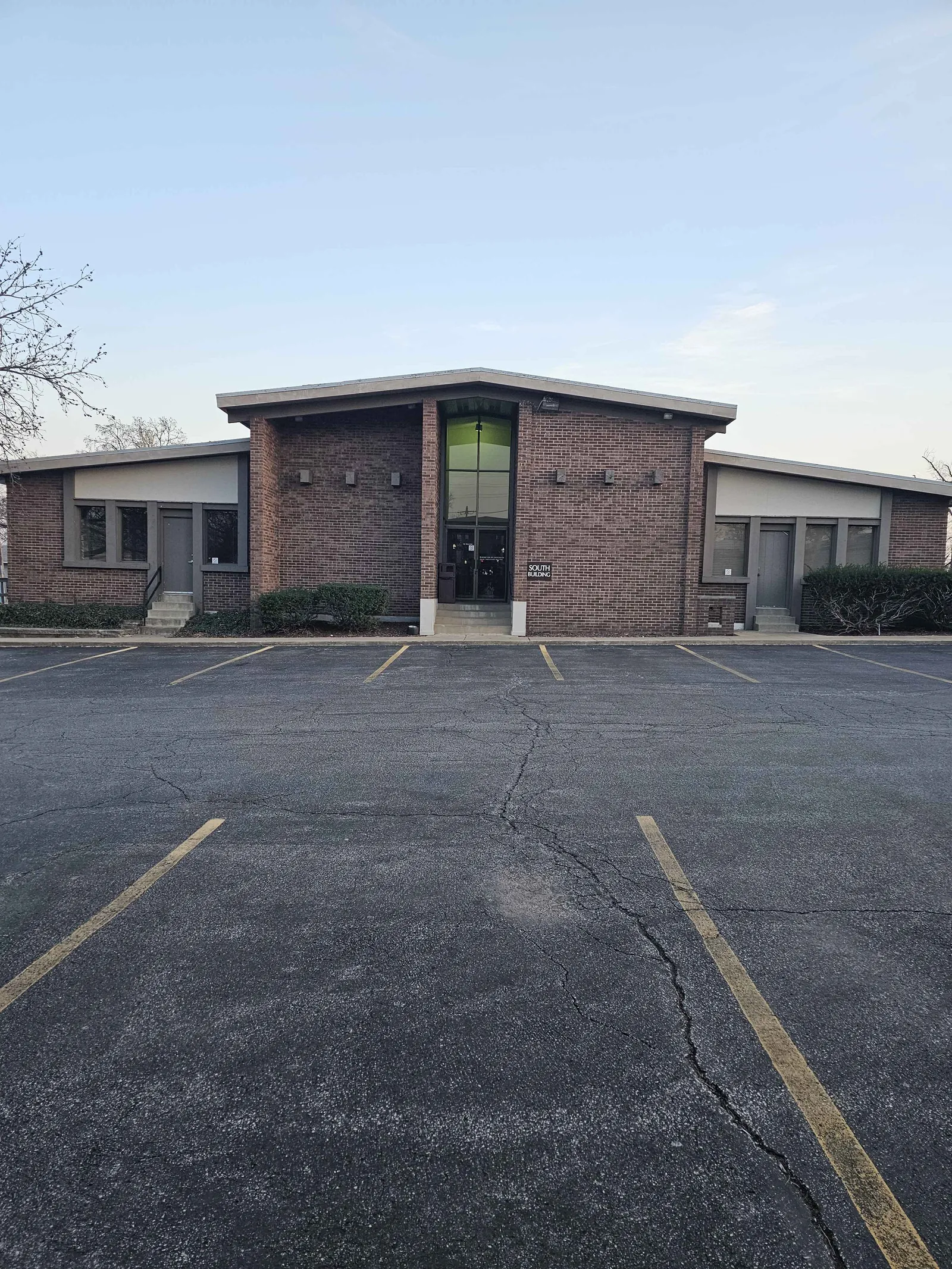 Crestwood Medical South Building at 10000 Watson Rd — brick professional office building with ample parking